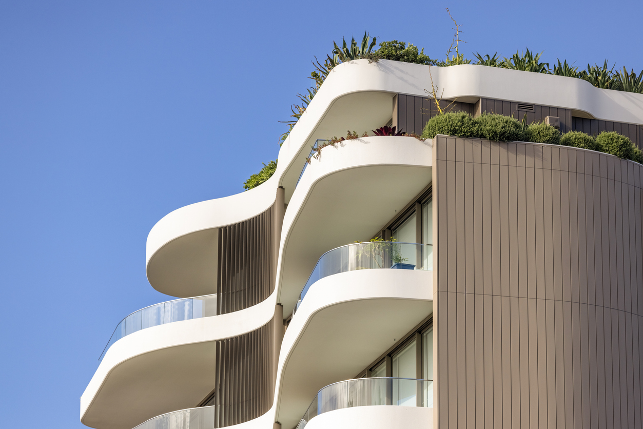 Top part of new, modern apartment building, background with copy space, full frame horizontal composition